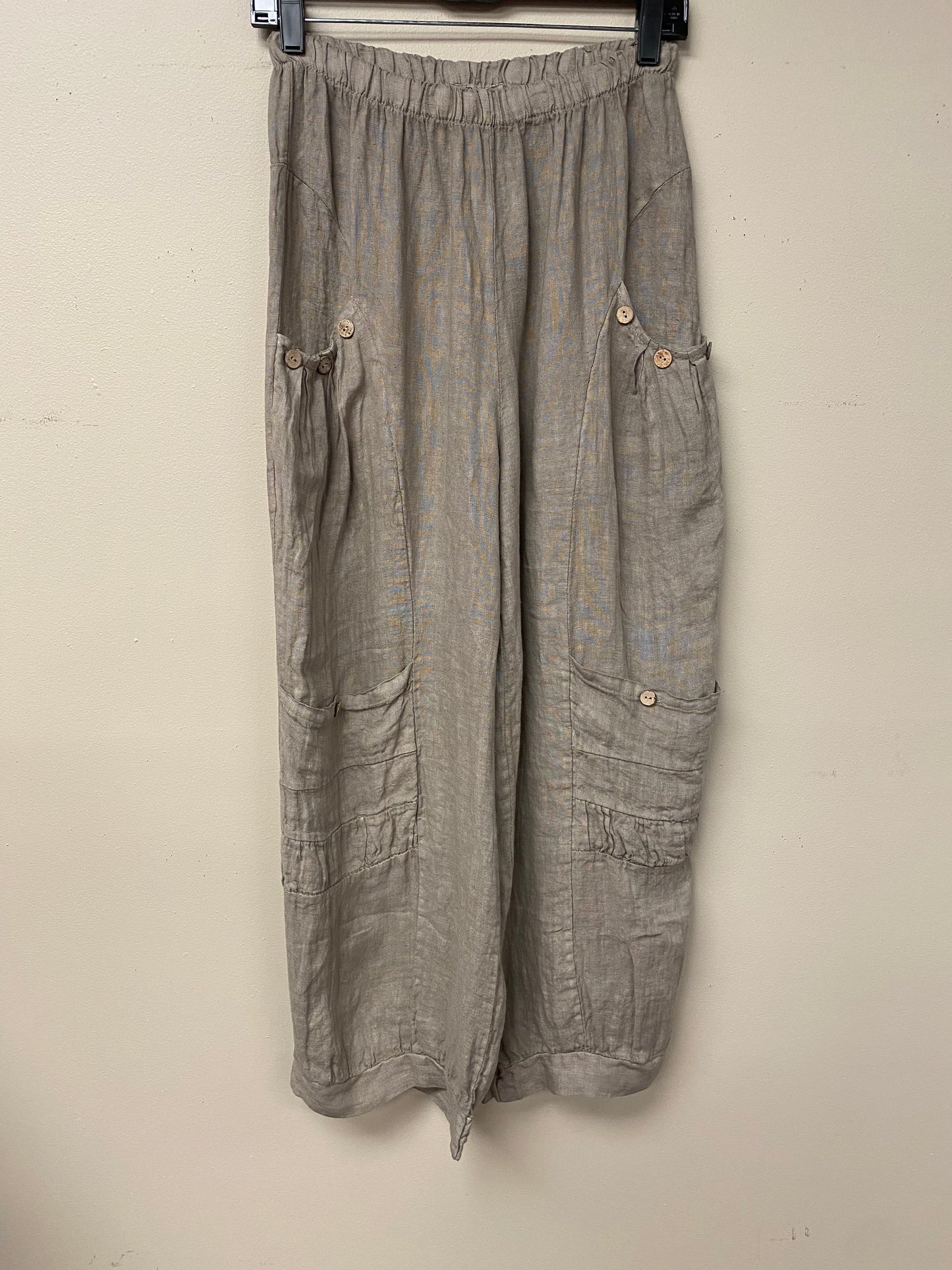 Four pocket Italian linen pants with button accent.