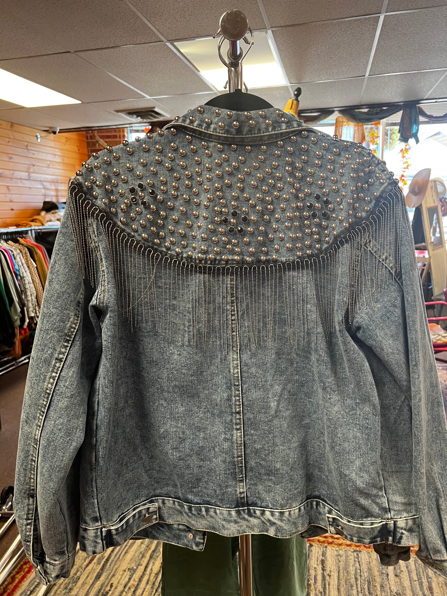 Fringe studded denim jacket.
