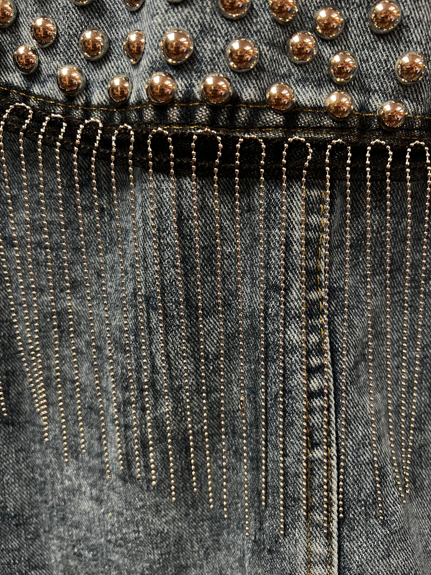 Fringe studded denim jacket.
