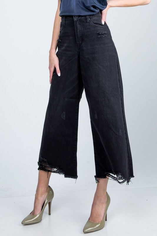 High Rise Super Wide Jean with distressed hem.