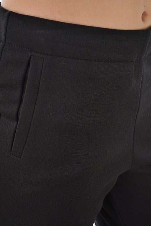 Skinny leg knit trouser with a side zipper.