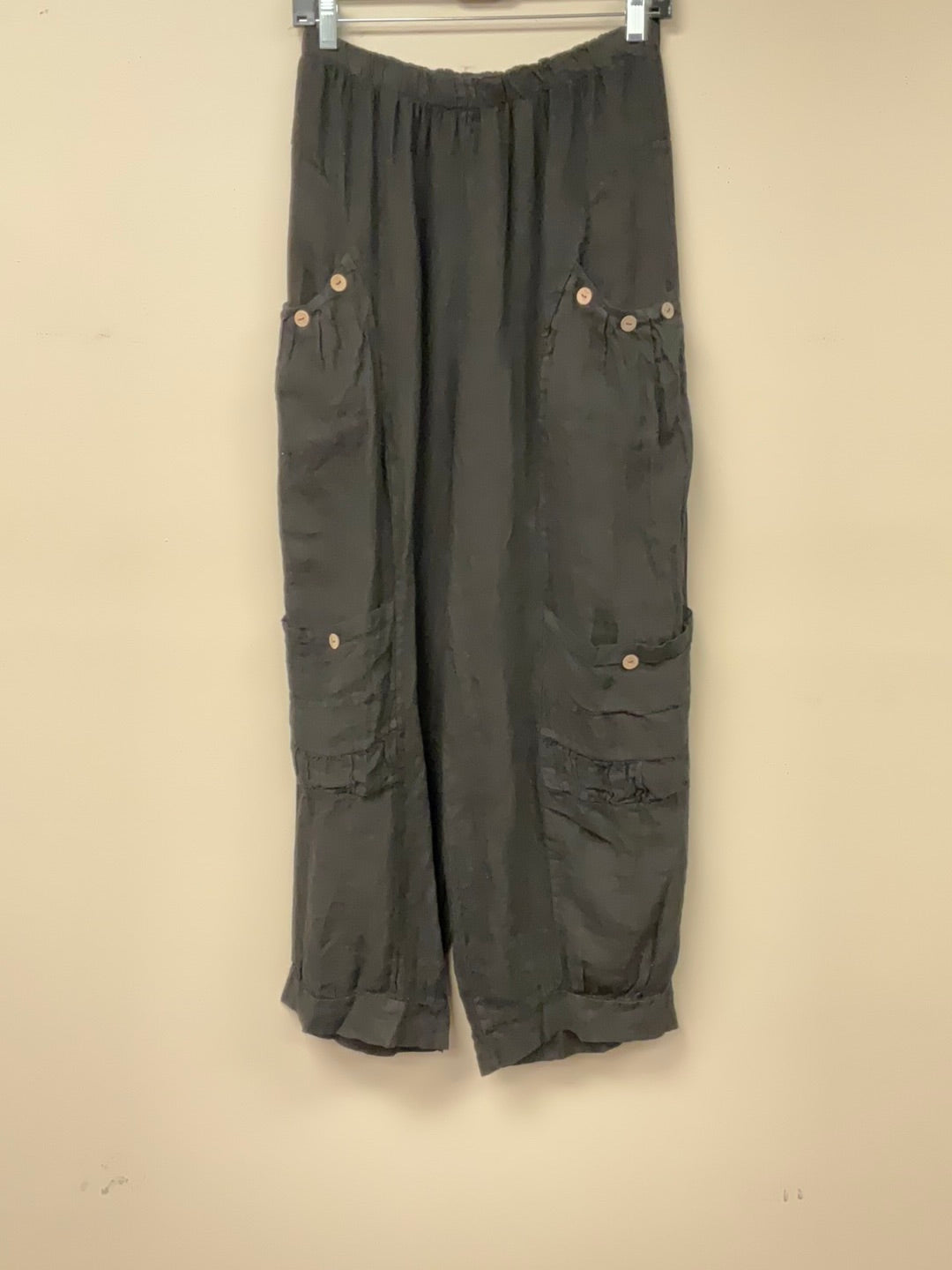 Four pocket Italian linen pants with button accent.
