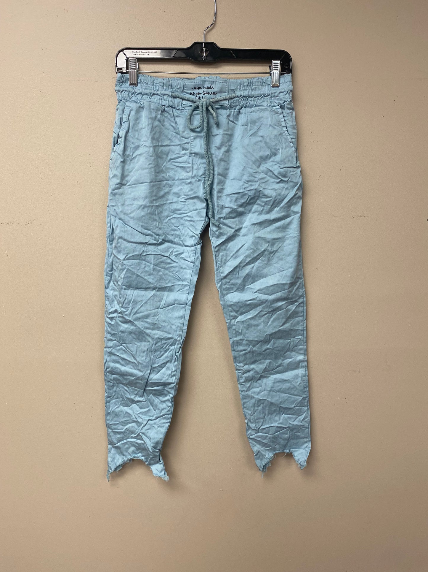 Distressed hem, Italian drawstring joggers.