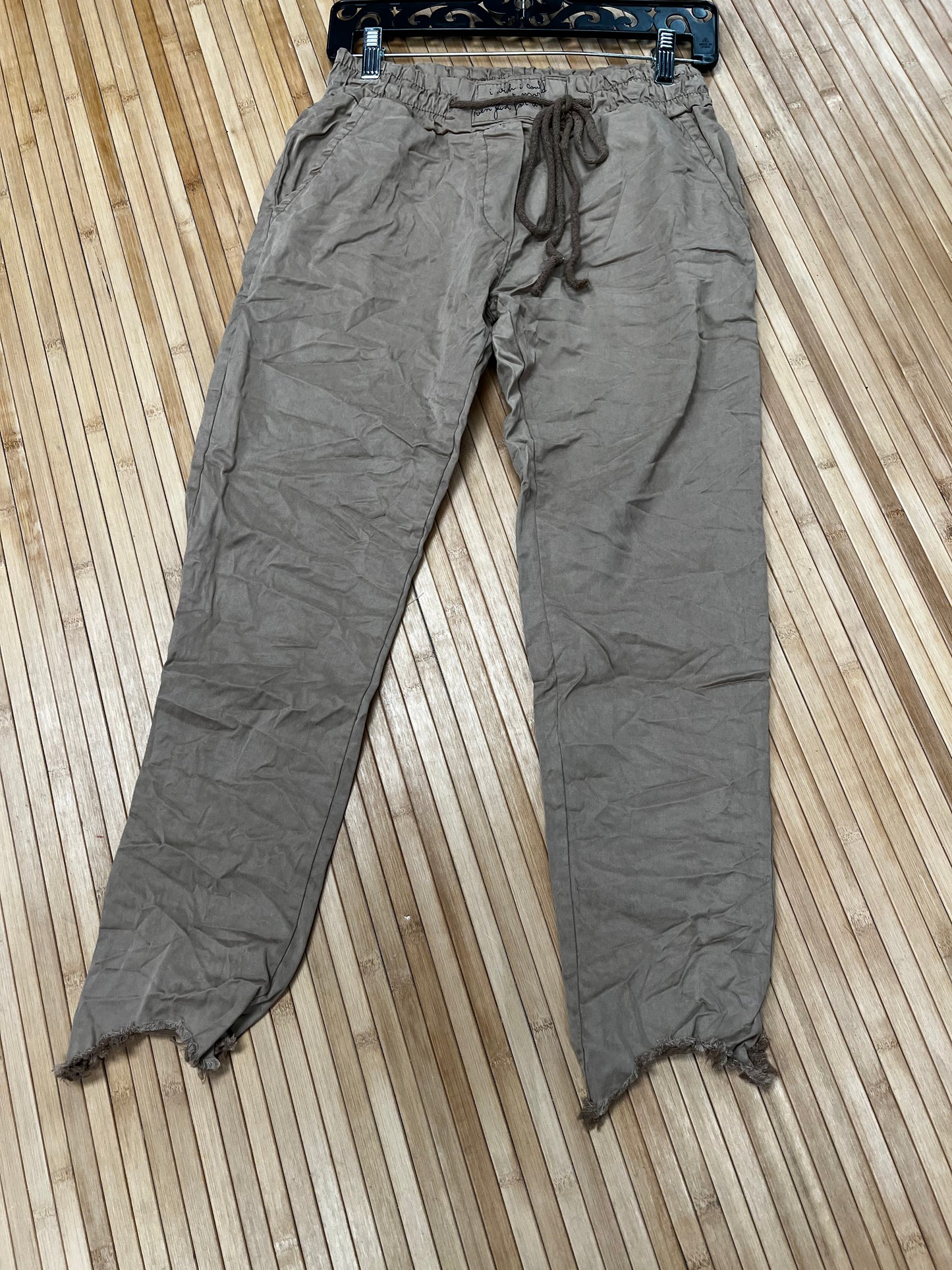 Distressed hem, Italian drawstring joggers.