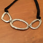 Adjustable jersey and aluminum short or long necklace with 3 irregular ovals.