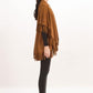 Suede shawl with fringes.