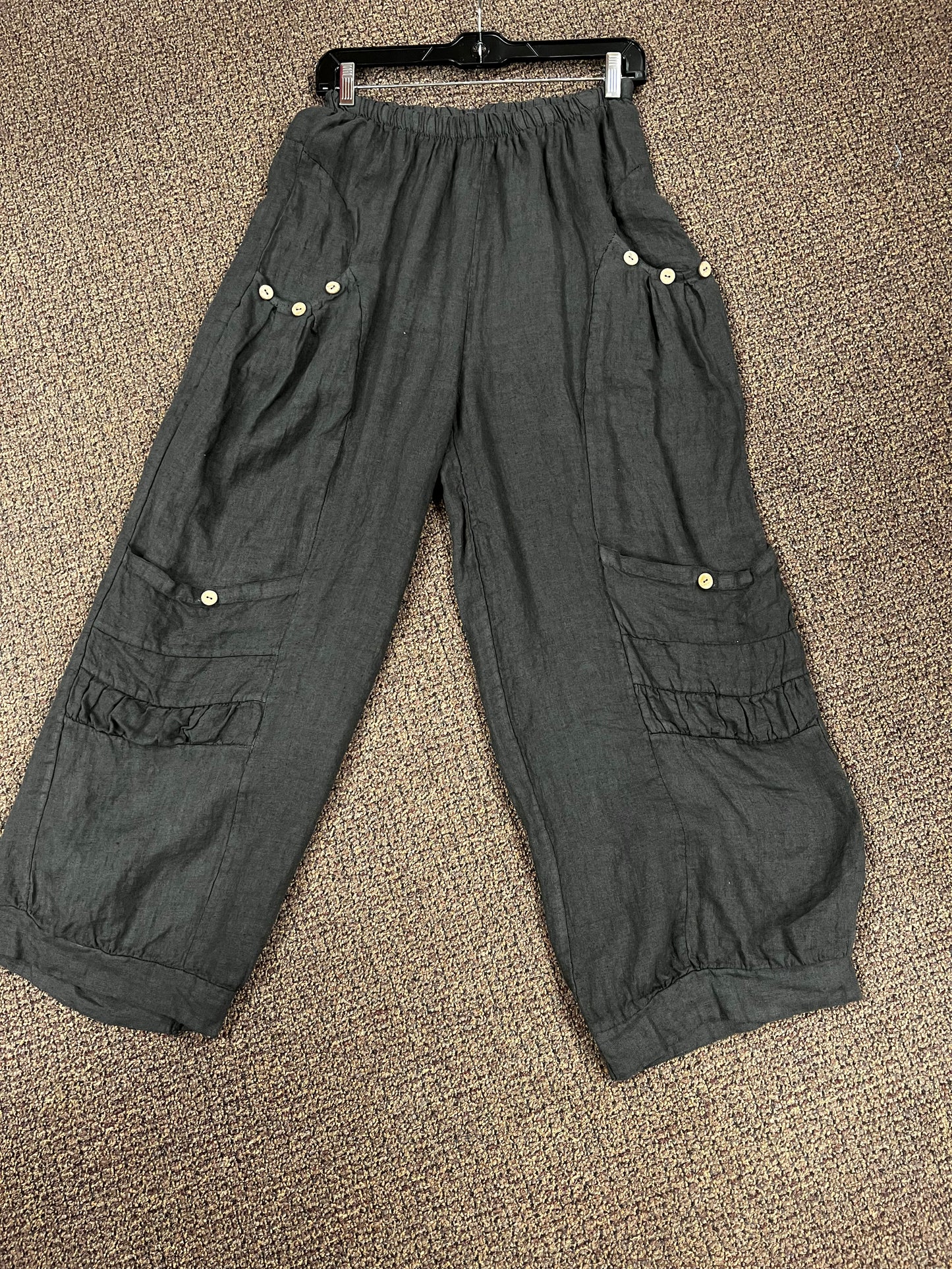 Four pocket Italian linen pants with button accent.