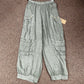 Four pocket Italian linen pants with button accent.