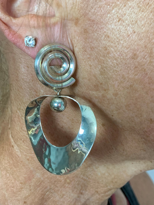 Sterling Silver spiral post hammered earrings, total length 2”.